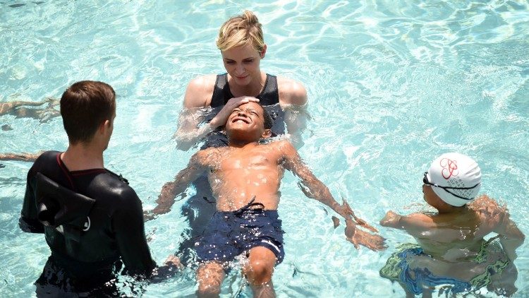 The Princess teaching children to swim