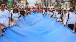 Animadores Laudato Si’ em ação de incidência profética durante a participação da Igreja Católica na COP30, Belém, Brasil, 2025. 